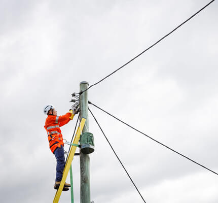 Electrician working on a Level 2 ASP service connection