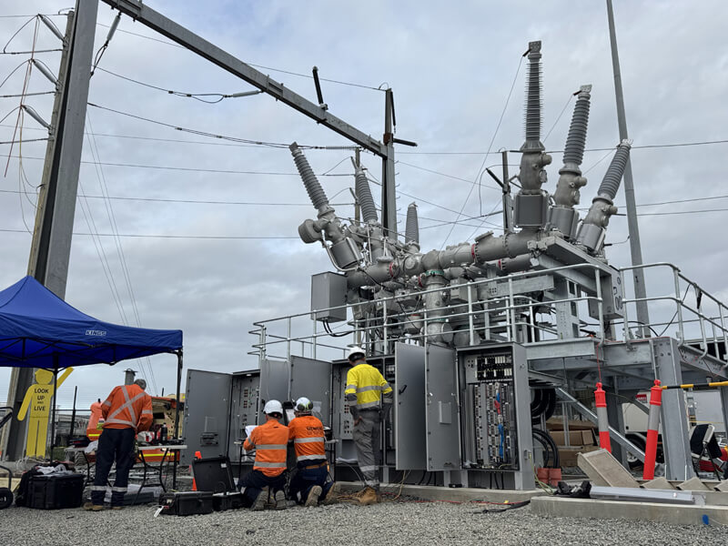 Electrical workers performing work at a high-voltage substation